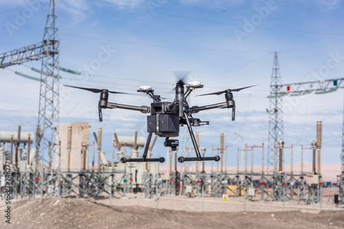 Drone flying and working for ortophoto and thermal analysis of PV Plants with visual and thermal camera. UAV are used for easy aerial inspections of Solar, Wind and Hydro renewable energy resources