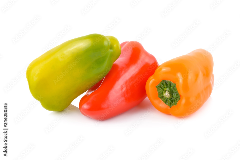 fresh Aura sweet red, orange and yellow-green peppers on white background fresh Aura sweet red, orange and yellow-green peppers on white background