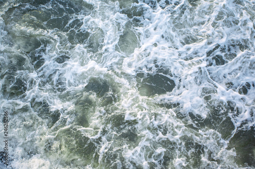 rough sea surface with waves and foam, top view, background, texture