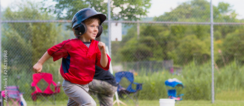 Young Child Running During a Baseball Game