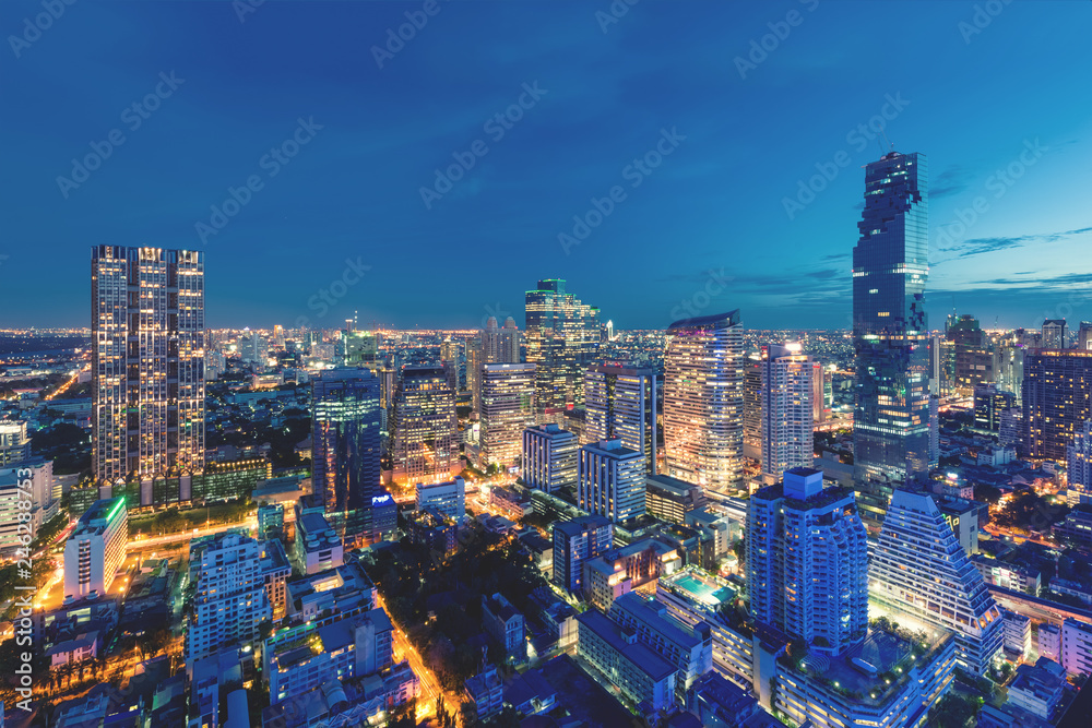 Fototapeta premium Modern building in Bangkok business district at Bangkok city with skyline at twilight, Thailand.
