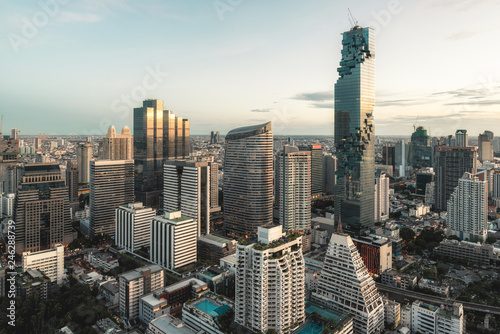 Aerial view of Bangkok modern office buildings in Bangkok city downtown with sunset sky , Bangkok , Thailand