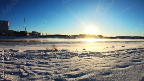 Sun rising in Finland lake Joensuu photo