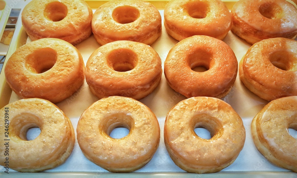 Donuts on bakery tray. 