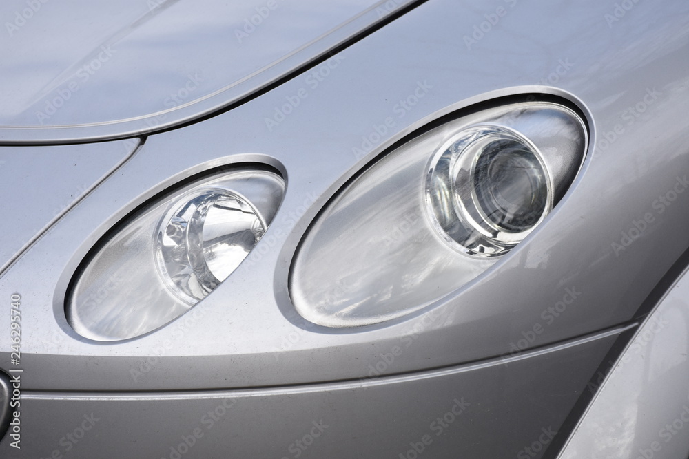 shiny headlight on a  white car