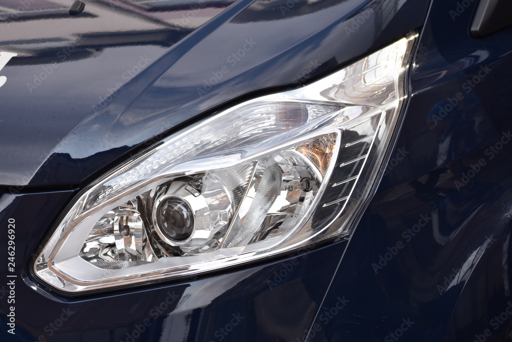  Car's exterior details. shiny headlights on a  black car