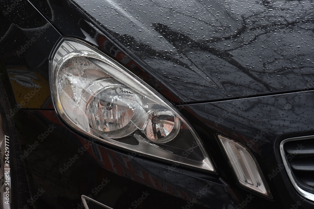 shiny headlights on a black   car