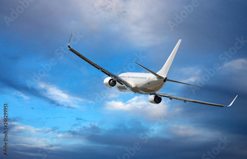  Aircraft is flying in blue cloudy sky