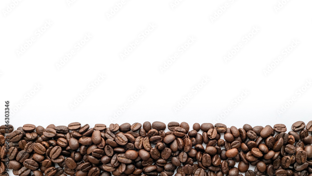 Roasted coffee beans on white background. Close-up. Roasted coffee beans on white background. Close-up.
