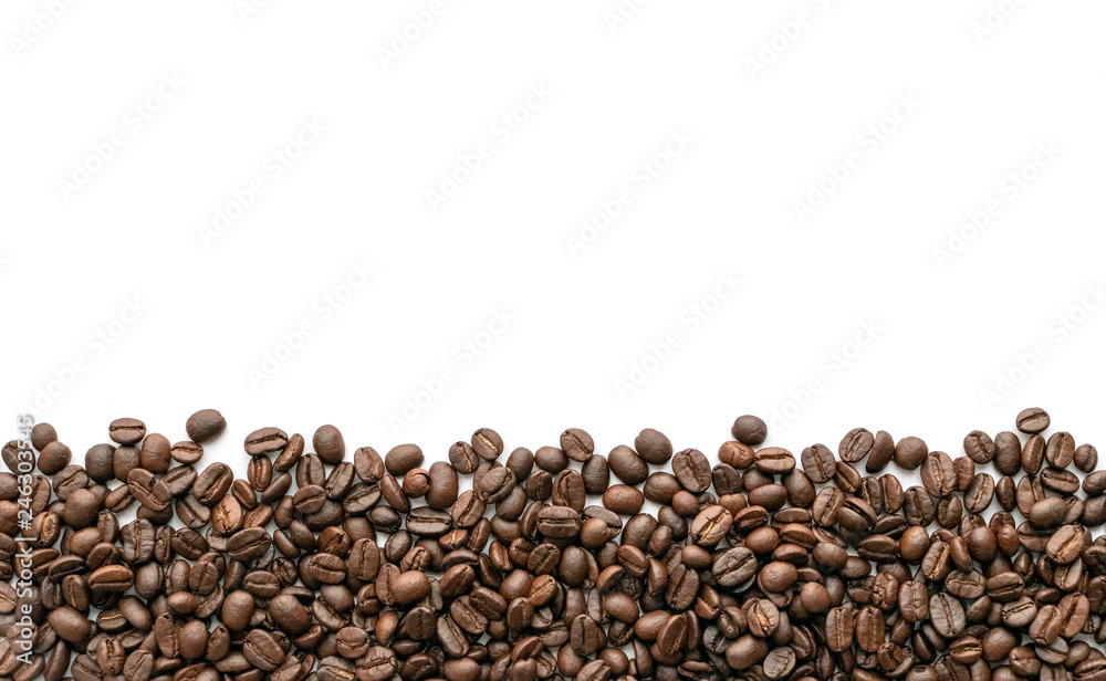 Roasted coffee beans on white background. Close-up. Roasted coffee beans on white background. Close-up.