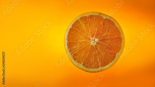 sliced ​​orange on orange background.
