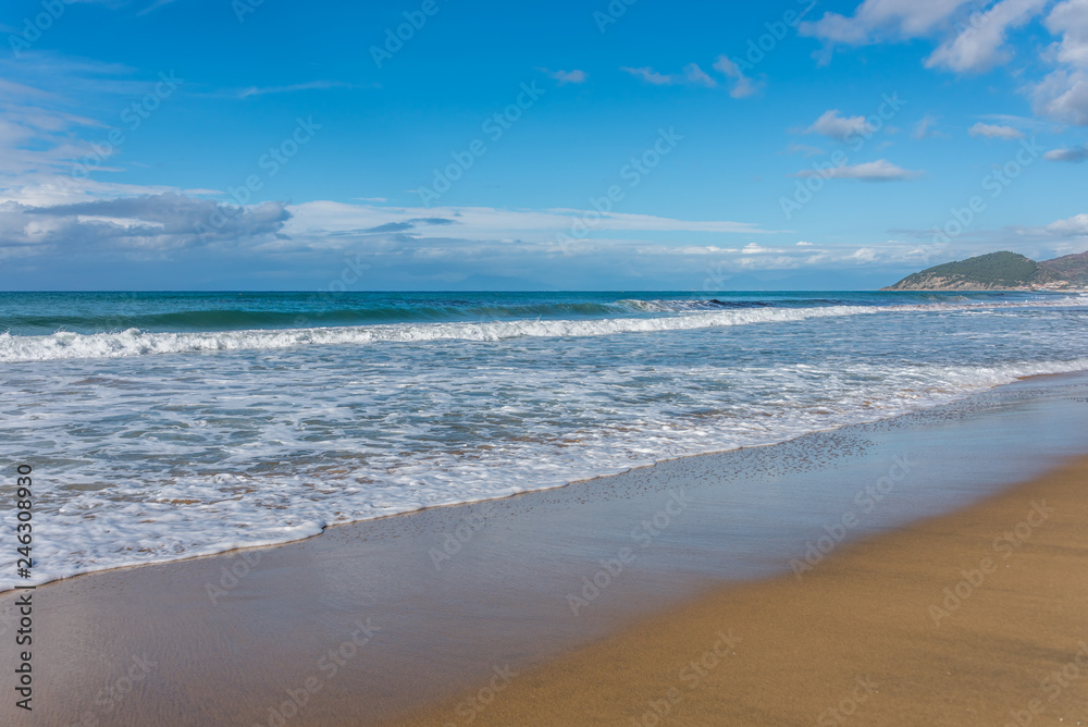 Waves Washing up on the Beach on the Southern Italian Mediterranean Coast on a Sunny Day Waves Washing up on the Beach on the Southern Italian Mediterranean Coast on a Sunny Day
