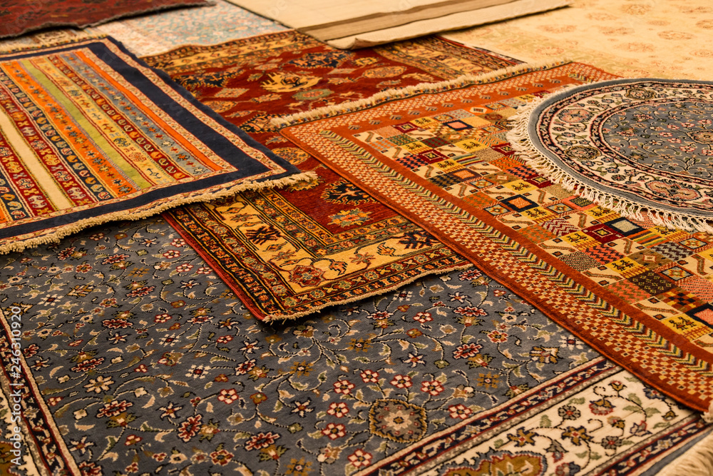 The carpets on the background in the shop for special costumers from Nevsehir, Sivas and other Turkish city in Turkey.
