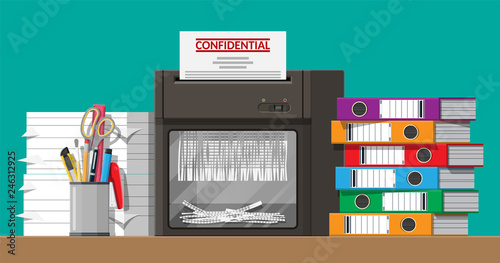 Paper document in shredder machine.