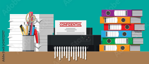 Paper document in shredder machine.