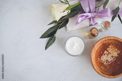 Spa natural skin care products background with space, cosmetic products - cream, oil and honey creative layout