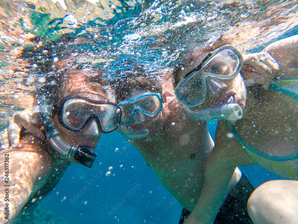 Underwater view of snorkeling friends