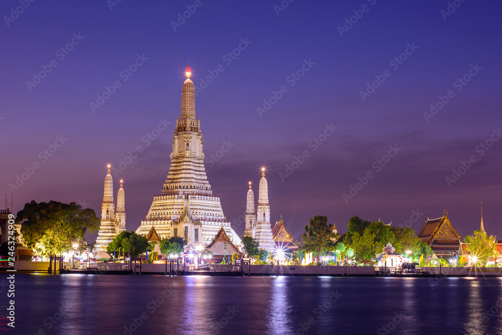 Wat Arun Ratchawararam Ratchawaramahawihan with reflections on the river in sunset time