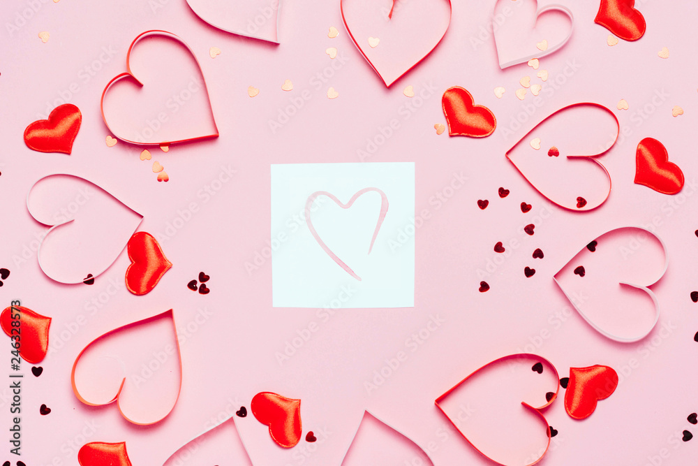 Valentine's day background. Little red hearts on pink background with shining lights bokeh. Valentine's day background. Little red hearts on pink background with shining lights bokeh.