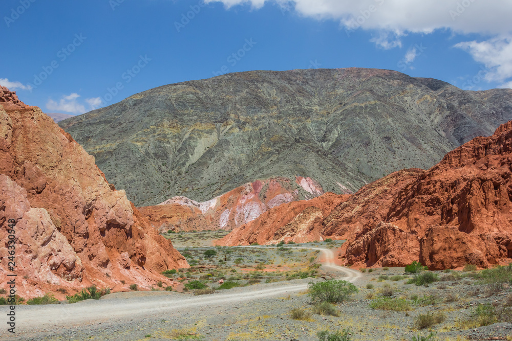 Gravel road through the hills of seven colors near Purmamarca, Argentina