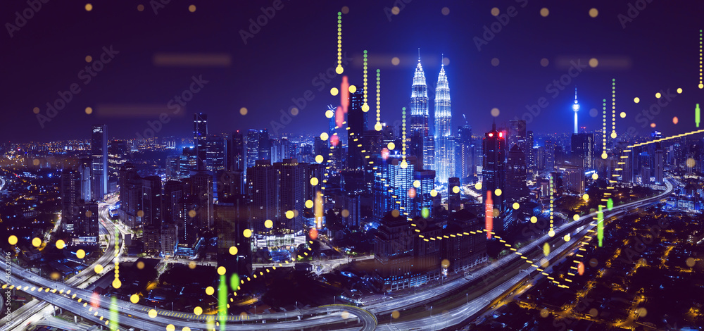 Beautiful Kuala Lumpur skyline at night with financial chart state blend in effect . Beautiful Kuala Lumpur skyline at night with financial chart state blend in effect .