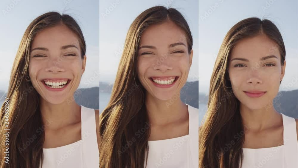 Woman Portrait Incl Making Heart Shape With Hands Smiling Laughing at Camera - Vertical Video. Smiling female is enjoying at tourist resort.
