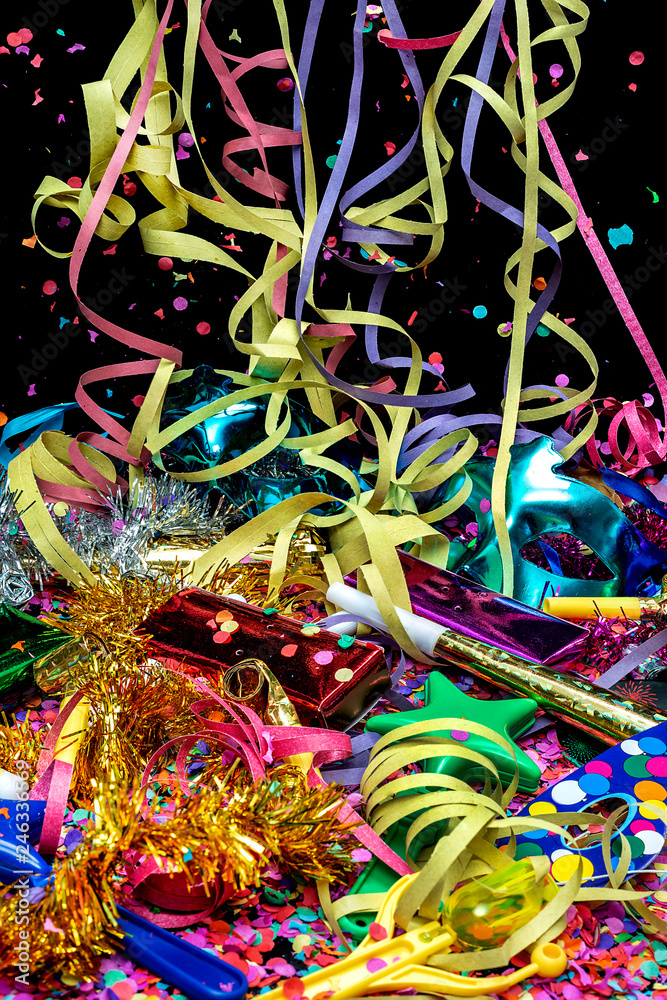 Masks and carnival objects with confetti and streamers