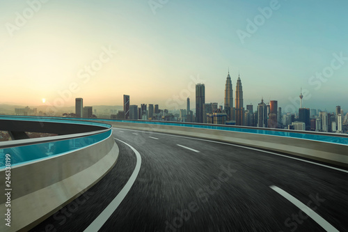 Highway overpass motion blur with city background . © jamesteohart