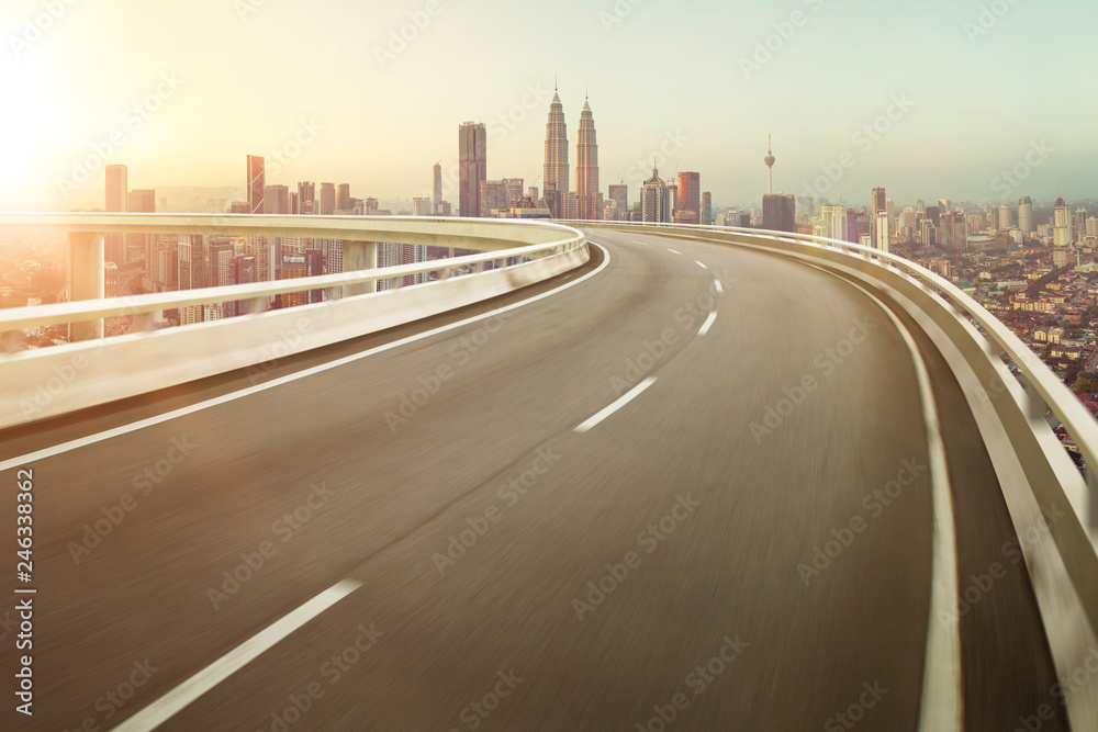 Highway overpass motion blur with city background .