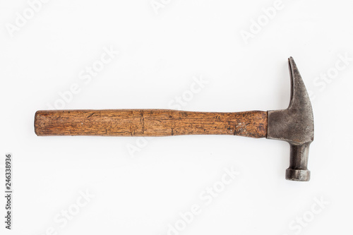 The vintage old hammer tool for the wood working job, Carpenter tool on the white background - vintage industrial tool concept image