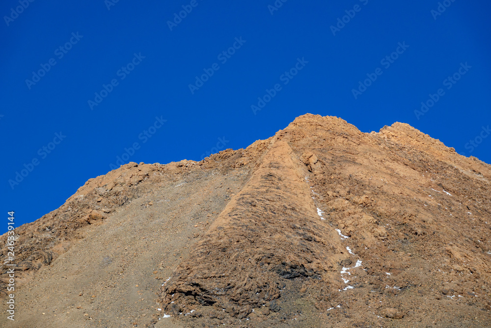 Teide iconic mountain crater with blue sky background