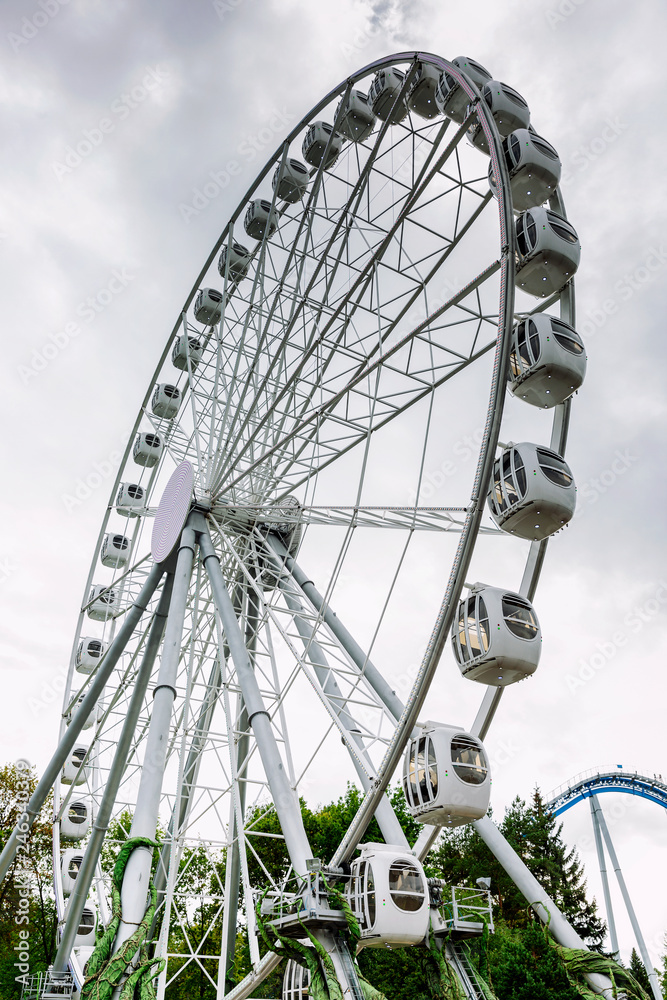 Ferris wheel in an amusement park, bottom view, vertical Ferris wheel in an amusement park, bottom view, vertical