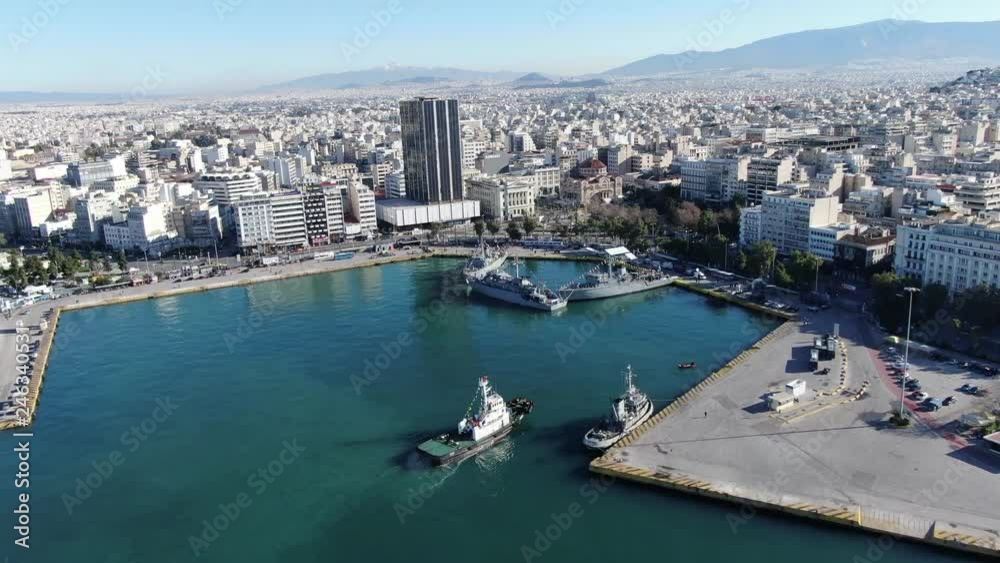 Aerial drone video of famous Christian ceremony of Epiphany in main port of Piraeus, Attica, Greece