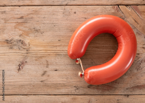 round sausage on wooden background