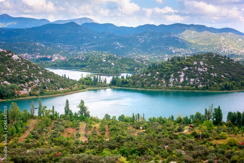 Amazing nature, scenic summer landscape with emerald lakes, mountains and blue cloudy sky, Bacina Lakes (Bacinska jezera), Croatia. Outdoor travel background, view from Adriatic highway