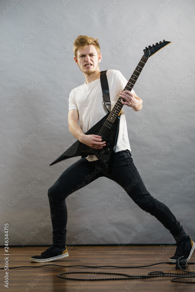 Man playing on electric guitar Man playing on electric guitar
