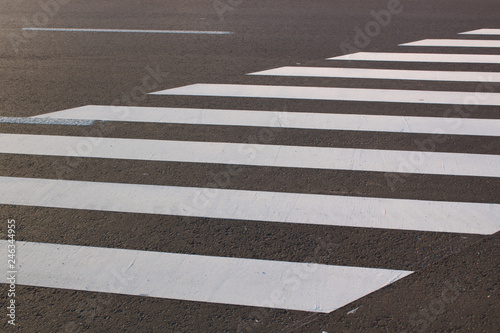 White . line on city asphalt road background. pedestrian crossing. Copy space for text.