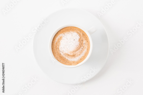 Coffee art. Latte cup on white background. Minimal flat lay.