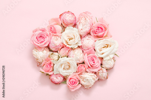 Flower gift concept. Delicate roses on pink background.