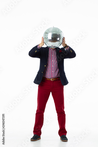 man in a bright suit on a white background with disco ball © Make_story Studio