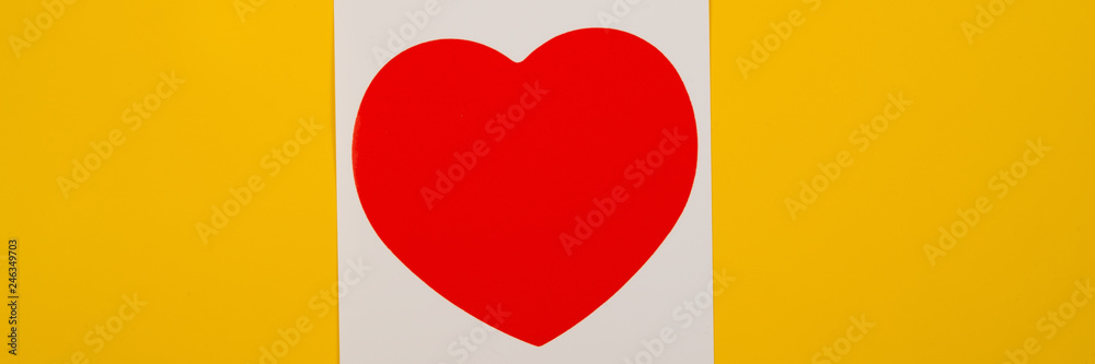 heart lies on a yellow background.