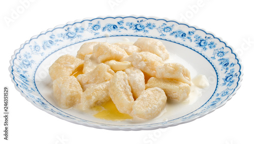 Traditional russian ukrainian cottage cheese "lazy" dumplings. On a white plate with a national ornament