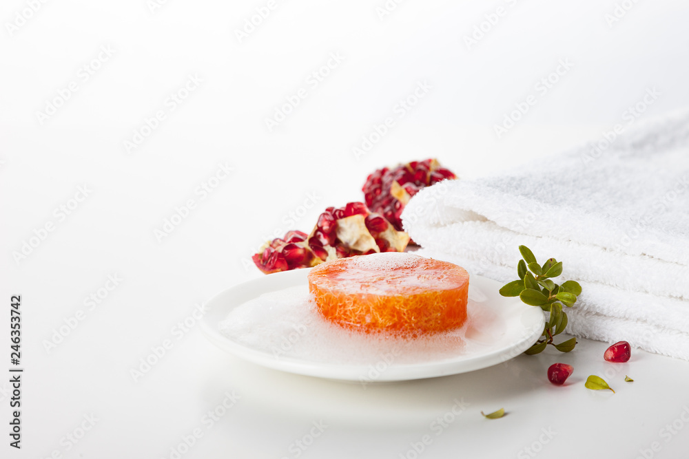 Natural handmade soap on a white background. Pomegranate-scented skin care. Spa treatments and aromatherapy for smooth and healthy skin. Natural handmade soap on a white background. Pomegranate-scented skin care. Spa treatments and aromatherapy for smooth and healthy skin.