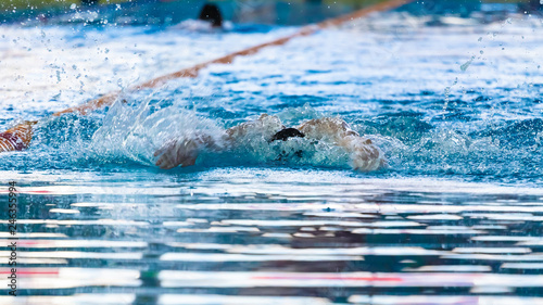 Fototapeta Naklejka Na Ścianę i Meble -  Swimmers compete in the sports pool