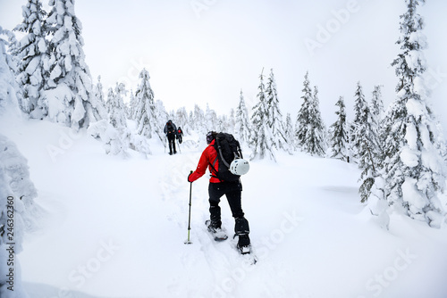 Men trekking in the mountains. Winter mountain landscape.