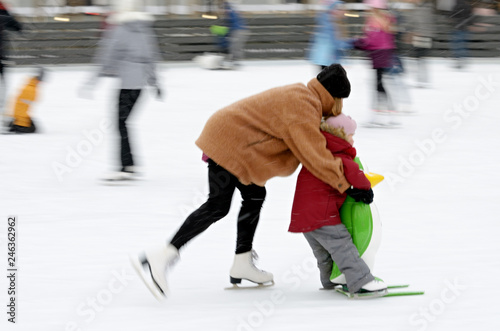 Obraz na plátně Skating on the ice rink.