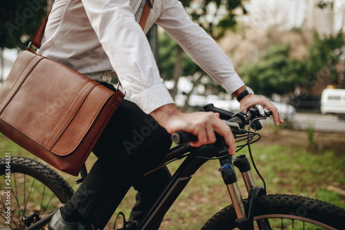 Fotografija Man commuting to office on bicycle