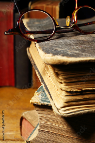  old books and glasses