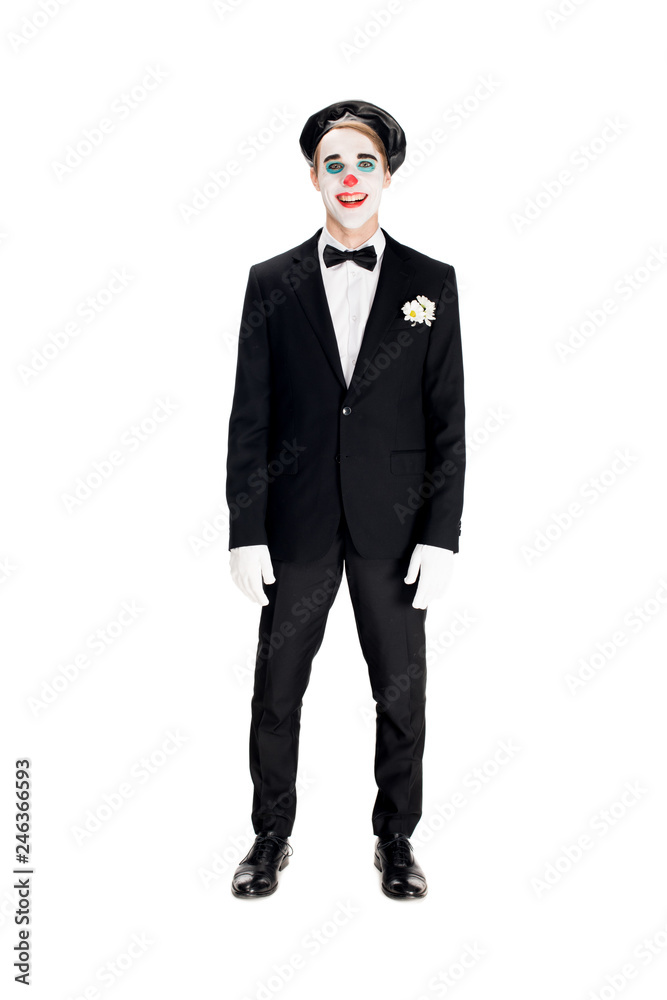 Obraz premium cheerful clown in black beret and suit smiling isolated on white