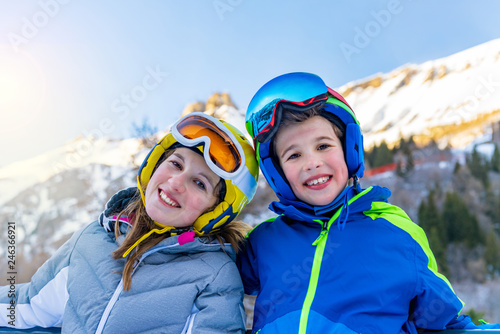 Portrait of little skiers laughing